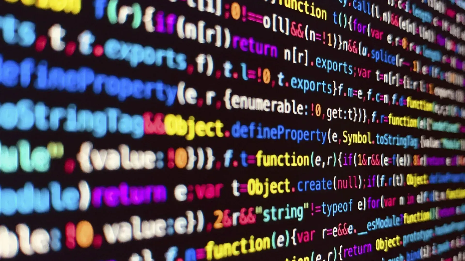 A close up of a computer screen with lots of colorful code